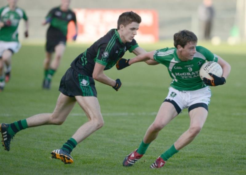 Ronan Sweeney on the ball for Clonguish in this tussle with Northern Gaels opponent Cathal Lynch. Action from the Minor 'A' Final.