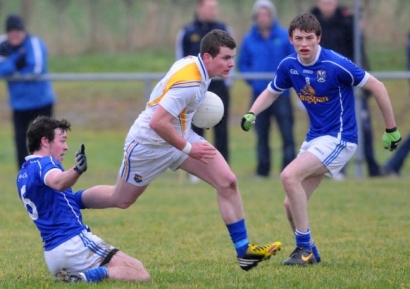 Longford's Barry McKeon determinedly bursts past the tackles of Cavan's Senan Gilchrist and Conor Moynagh. Photo: Declan Gilmore