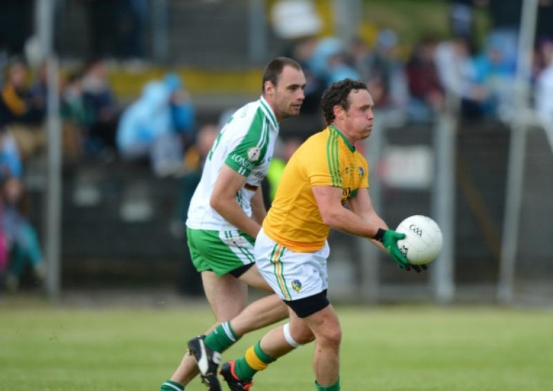 Former Longford footballer Enda Williams (now playing with Leitrim) lets the ball go as London player Mark Gottsche closes in during the Connacht Senior Football Championship Semi Final on Sunday last at Pairc Sean Mac Diarmada Carrick on Shannon. Pic: Ray Donlon