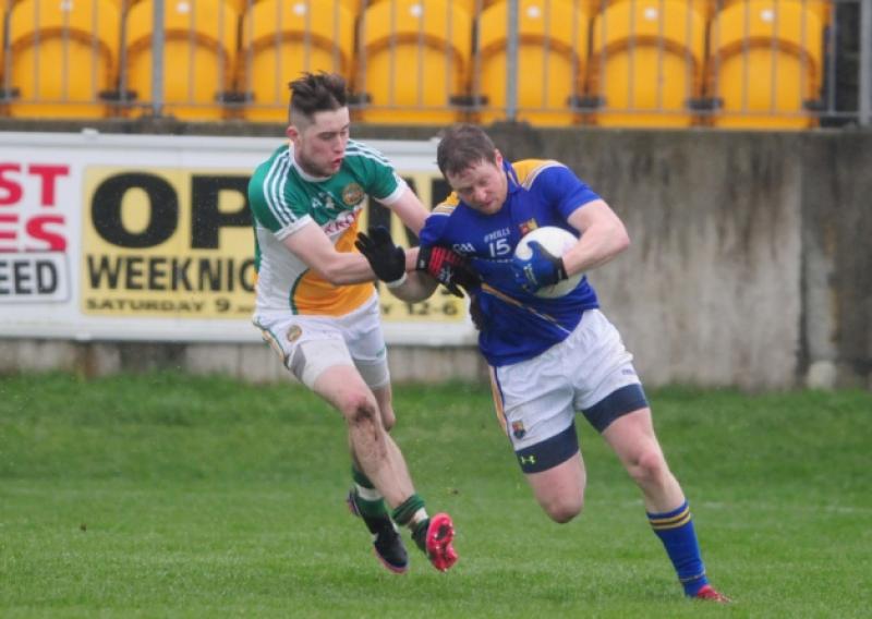 Longford forward Sean McCormack breaking away from Offaly defender David Hanlon. Action from the National Football League Division 3 game at O'Connor Park in Tullamore on Sunday. Photo: Kevin Leavy