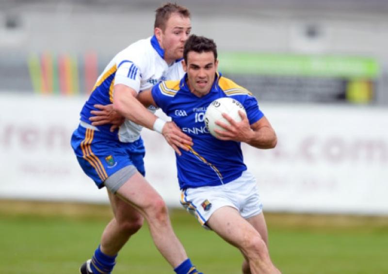 Bernard McElvaney on the ball for Longford as he battles with Wicklow player James Stafford during the first round of the Leinster Senior Football Championship on Sunday last in Aughrim. Photo: Ray Donlon