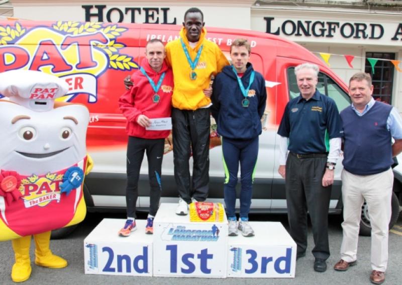 Top finishers in the Pat the Baker Longford Marathon: 2nd - Gary O'Hanlon, 1st - Freddy Keron Sittuk, and 3rd - Liam Feeley, with Fr Ciaran McGovern and Michael Meaney. Photo: Shelley Corcoran