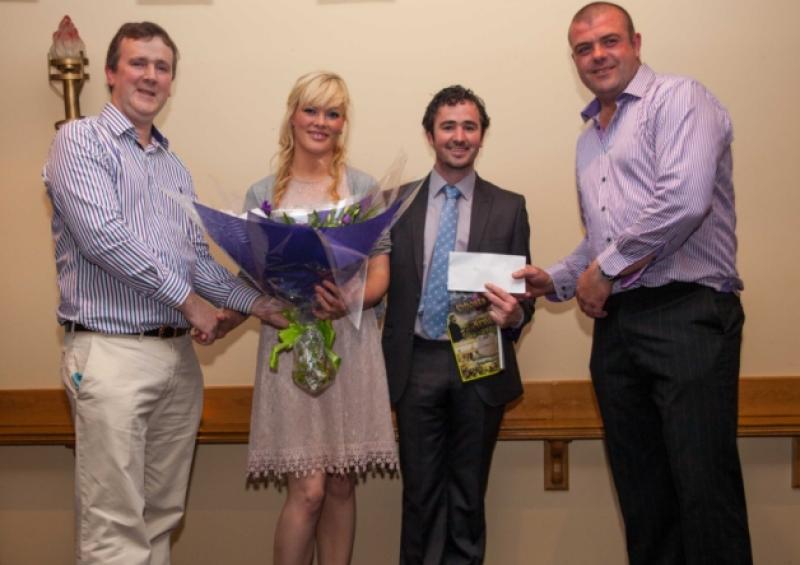 Cormac O'Donnell hands over a bouqet of flowers to Terri Masterson while Nicky O'Hara (far right) shakes hands with David Brady.