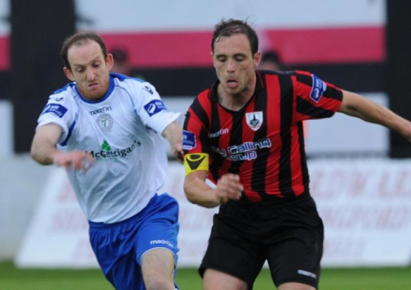 Stephen Rice on the ball for Longford Town in this tussle with Finn Harps opponent Michael Funston. Action from the Airtricity League First Division game at City Calling Stadium on Saturday night last. Photo: Kevin Leavy