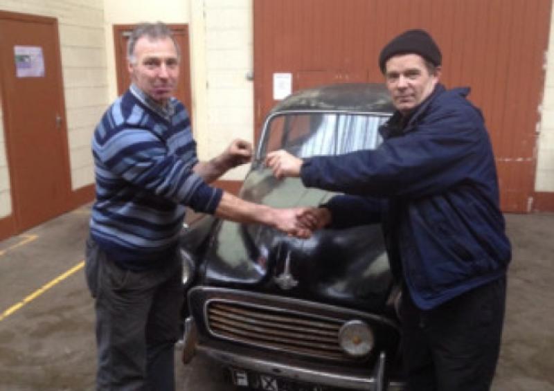 Harry McKenna of Longford Vintage Club handing over the keys of the Morris Minor to Kenneth Martin of the Motor Technology course in the old St Mel's Education Centre on the Battery Road, which is now run by Templemichael College PLC.