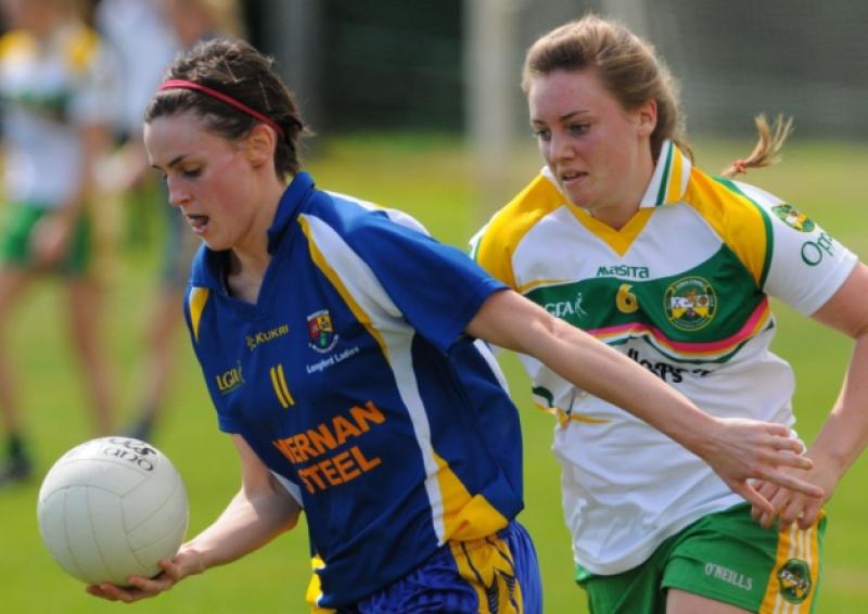Ann Marie Bratten on the attack for Longford in breaking away from Offaly opponent Hannah McMahon. Action from the recent Leinster Final. Photo: Declan Gilmore Photography