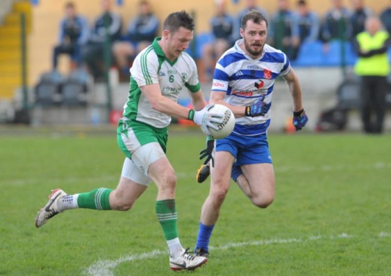 Michael Quinn surging forward for Killoe Emmet Og with Navan O'Mahonys opponent Cormac McGuinness in pursuit. Action from the Leinster Club senior football championship quarter-final at Glennon Brothers Pearse Park on Sunday last.  Photo: Declan Gilmore