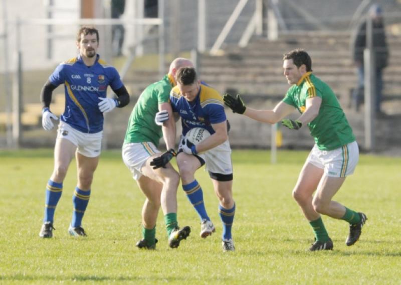 Michael Quinn on the ball for Longford in this tussle with Leitrim opponents. The other Longford player in the picture is Barry Gilleran. Action from the recent National Football League Division 4 game in Carrick-on-Shannon.  Photo: Kevin Leavy