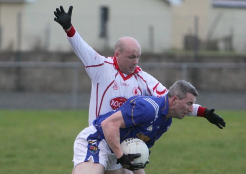 Longford's Ciaran Keogh evades a challenge from Tyrone's Peter Canavan during the All-Ireland Masters semi-final in Ballyconnell. Photo: Adrian Donohoe