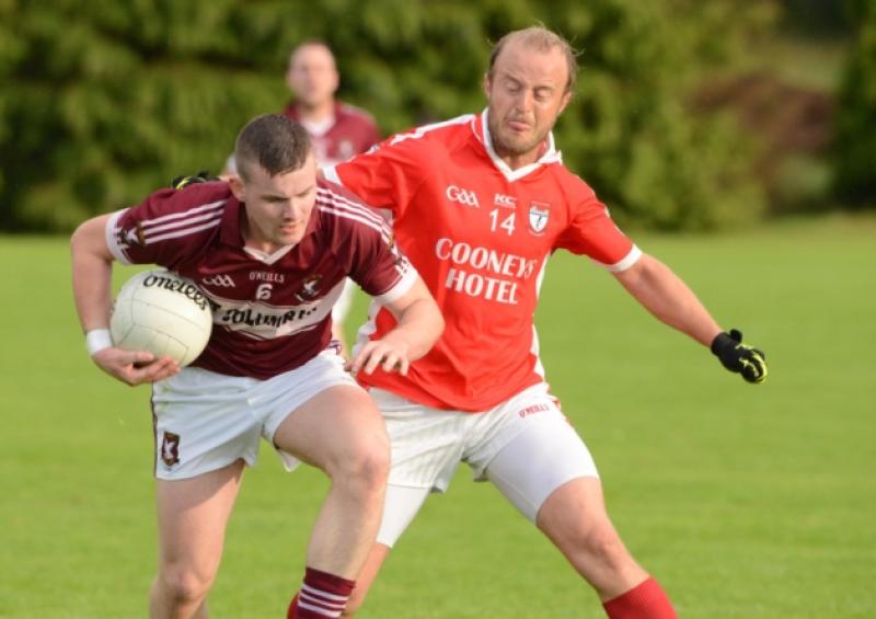Mullinalaghta St. Columba's defender James McGivney on the ball in this tussle with Ballymahon forward Thomas Lennon. Action from the Senior Football Championship Round 2 game at the Monaduff grounds, Drumlish on Saturday evening last. Photo: Declan Gilmore Photography