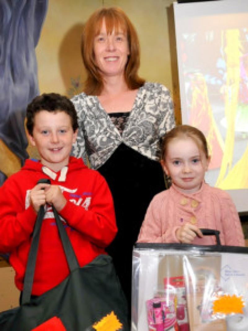 9-11yrs Art winners at the Aisling Festival with Agatha Farrell of Farrell-Coy are Cian Clancy Stonepark NS and Megan Lee Clontumpher NS.