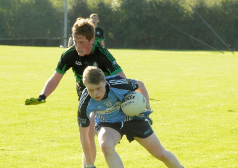 Robbie Clarke on the ball for Longford Slashers in his attempt to evade the challenge of Northern Gaels defender Cian Brady. Photo: Declan Gilmore Photography
