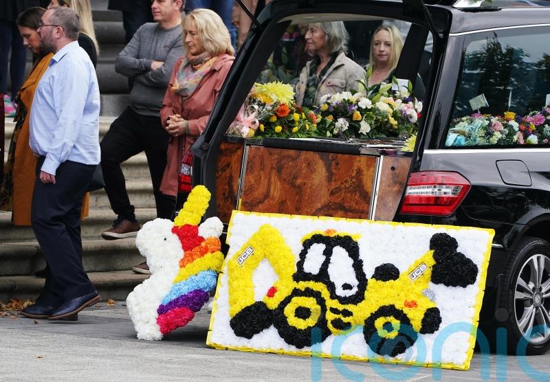Woman charged over deaths of two children in car fire
