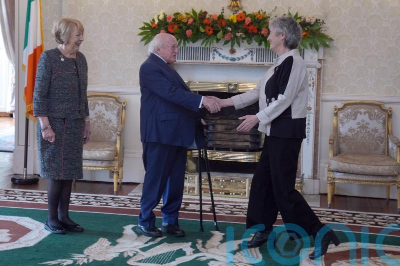 Hugs and handshakes as Ireland’s President welcomes his successor