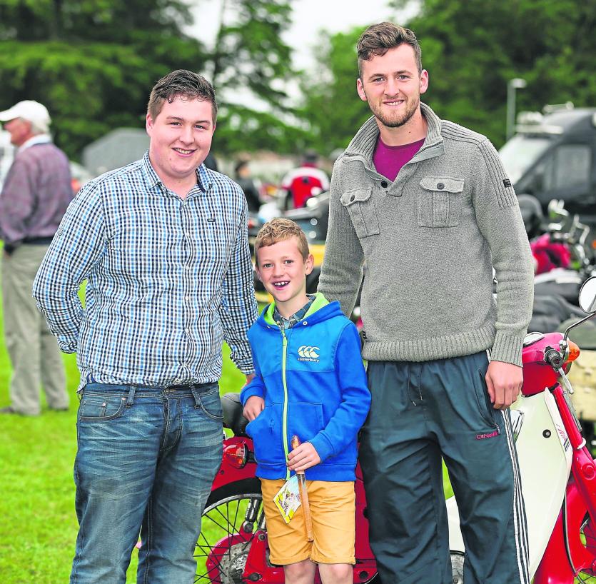 Jordan Shaughnessy, Brian and Sean Reynolds admiring the bikes
