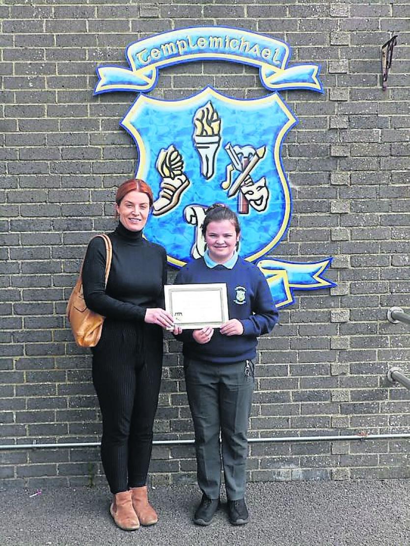 Niamh McCann receiving Junior Cert Art Student of the Year Award from Ms McHugh