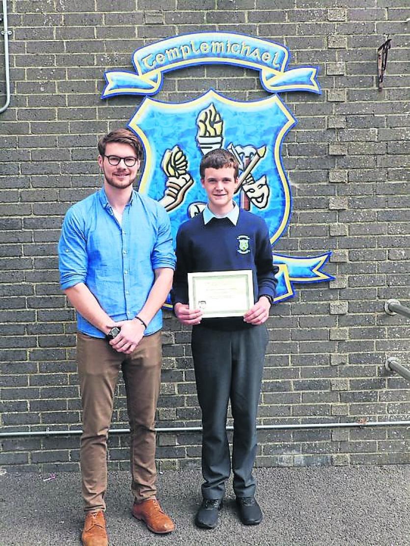 Neil Edgely receiving Junior Cert Materials Technology Student of the Year Award from Mr Prunty