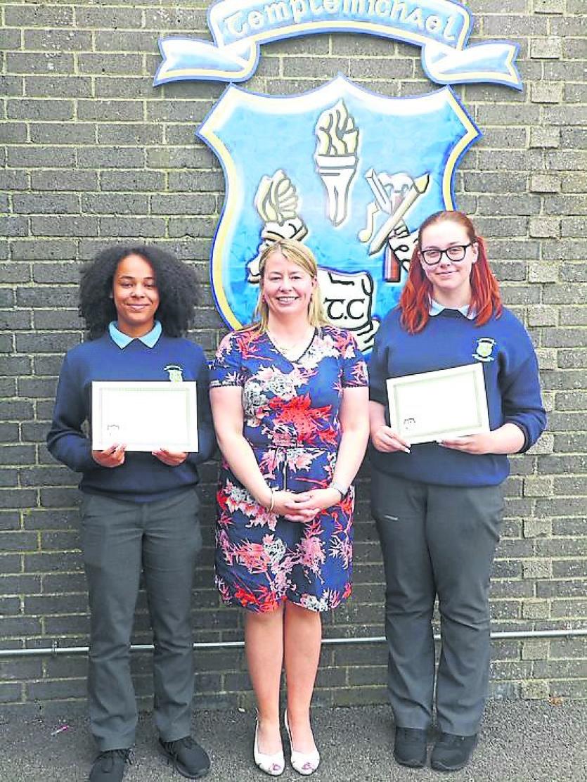 Naomi Togbe and Gemma Skelly, Longford Leader Schools Correspondents receiving their award for their excellent work throughout the year from Ms Doorle
