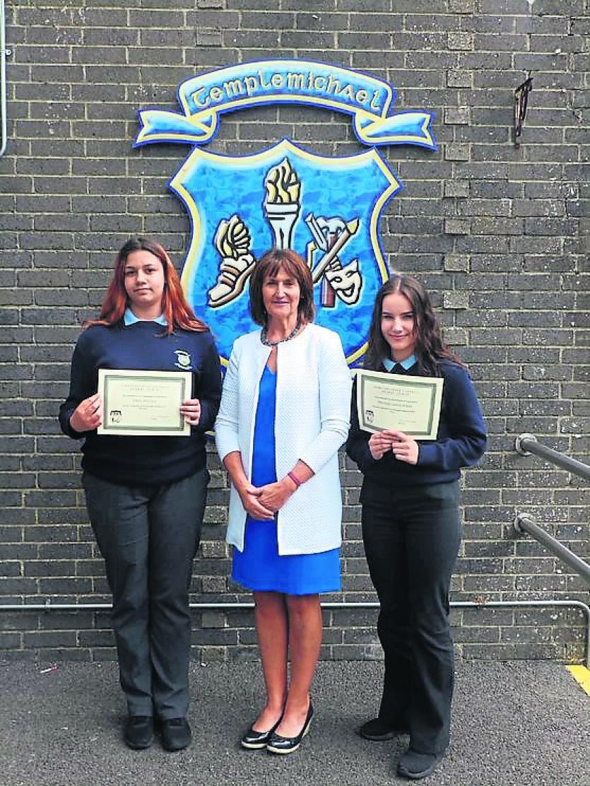 Auguste Buliauskaite and Sara Macieja receiving Junior Cert French Student of the Year and Junior Cert Spanish Student of the Year Awards from Ms Pyke