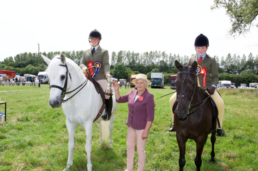 Champion Ridden Pony Ciara Dennigan with Judge Jane Somerville and reserve champion Holly Crosby. PICTURE: MICHELLE GHEE.
