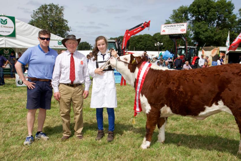 Sponsor Enda Flynn from Flynn and Lynch Life and Pensons with Judge John Kemp and Paula McMara with the Champion Junior Heifer. PICTURE: MICHELLE GHEE