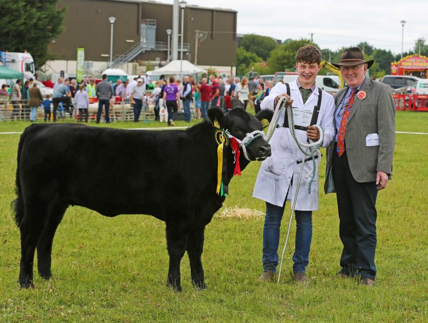 Champion Aberdeen Angus Millbawn Aurora. Conor Craig and Judge Michael Smith Photo by Shelley Corcoran