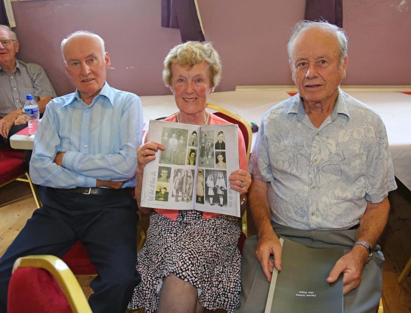 Pat Fealy, Eileen (Fealy) Hickey, with her photograph of her as a child, in the book, Pat Hickey Picture: Shelley Corcoran