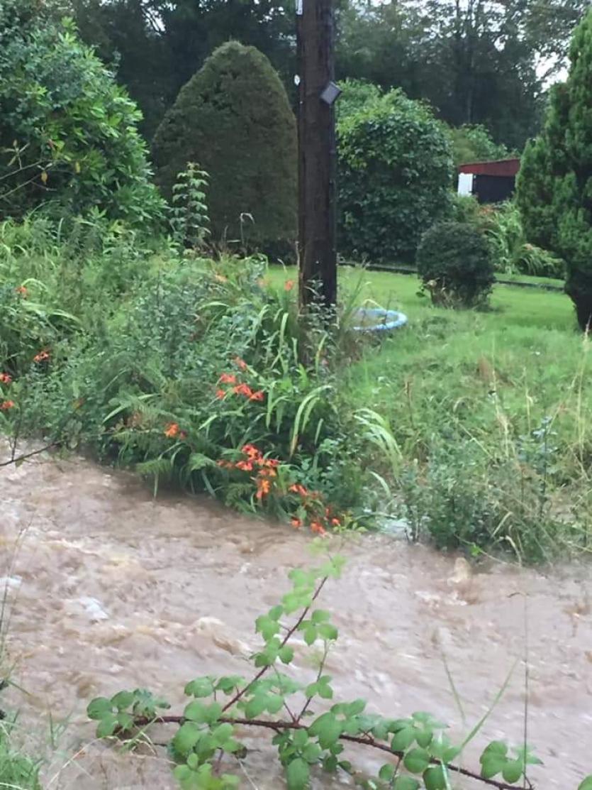 GALLERY | Flooding hell: Ballinalee resident feeling a bit safer as Longford County Council bring sand bags to combat flood threat