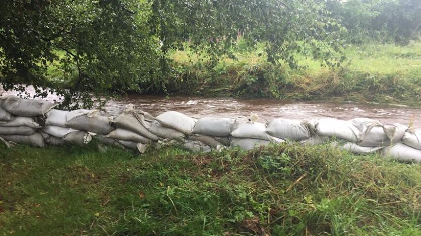 GALLERY | Flooding hell: Ballinalee resident feeling a bit safer as Longford County Council bring sand bags to combat flood threat