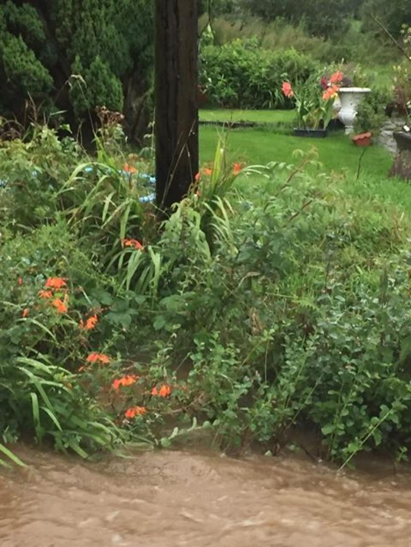 GALLERY | Flooding hell: Ballinalee resident feeling a bit safer as Longford County Council bring sand bags to combat flood threat