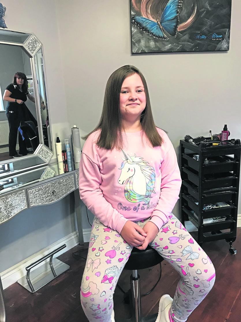 Niamh beaming after cutting her hair for charity