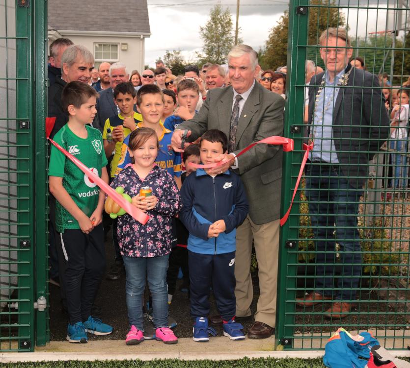 Past Principal Con Boyle opening the astro turf Picture: Shelley Corcoran