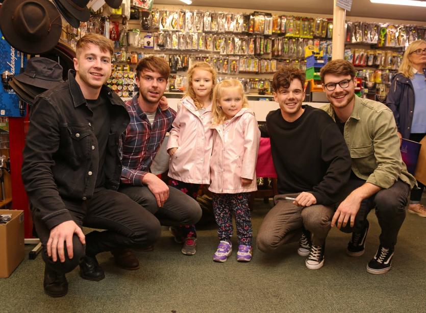 Kayla and Megan Gillooley with Brave Giant at their 'meet and greet' in Deniston's Longford after  the launch of their debut album