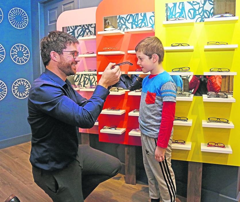 Stephen Olwell FAOI helping Leon Reilly choose the perfect frames