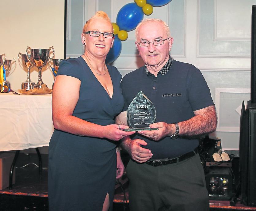 ILOL-08-11-19 Longford Ladies Presentation 03.       Longford LGFA President Liam Forde presents a trophy to Longford Minor Ladies manager Carol Leona