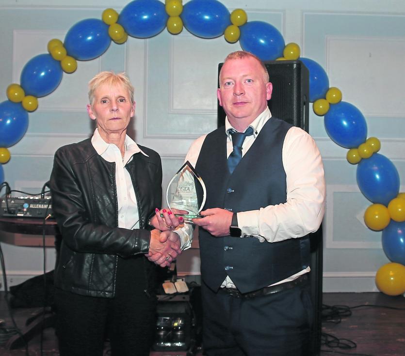 ILOL-08-11-19 Longford Ladies Presentation 02.   Longford LGFA Chairperson Anne Jones presents a trophy to Under 16 Girls manager Paul McGuire to ackn