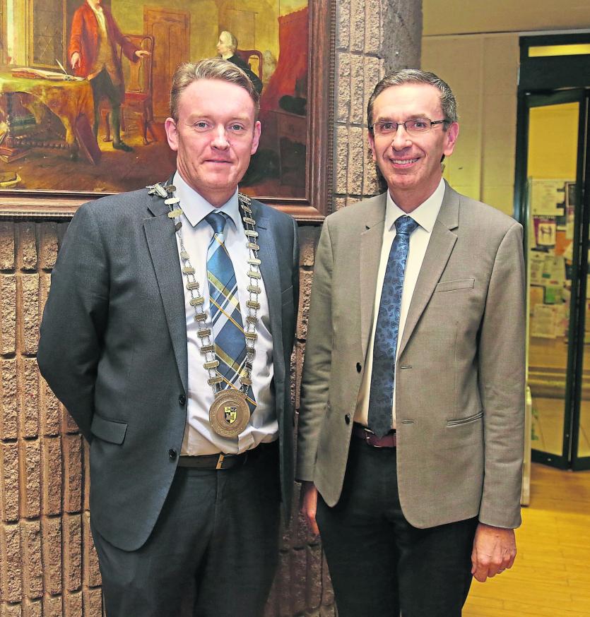 Cathaoirleach of Longford County Council Cllr Michéal Carrigy with County Archivist  Martin Morris at the launch of Teathbha