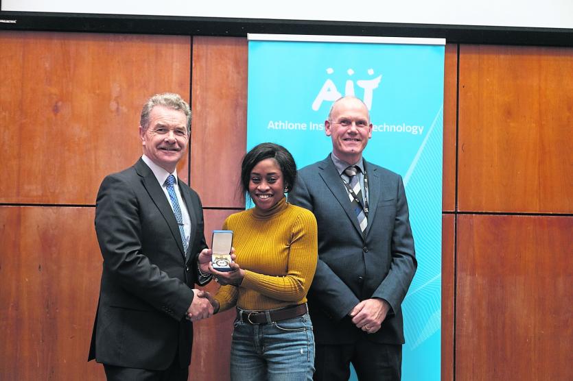 Eniola Omotade, a Bachelor of Arts (Hons) in Applied Social Studies student from Prospect Woods, Longford town, receiving an award for her outstanding