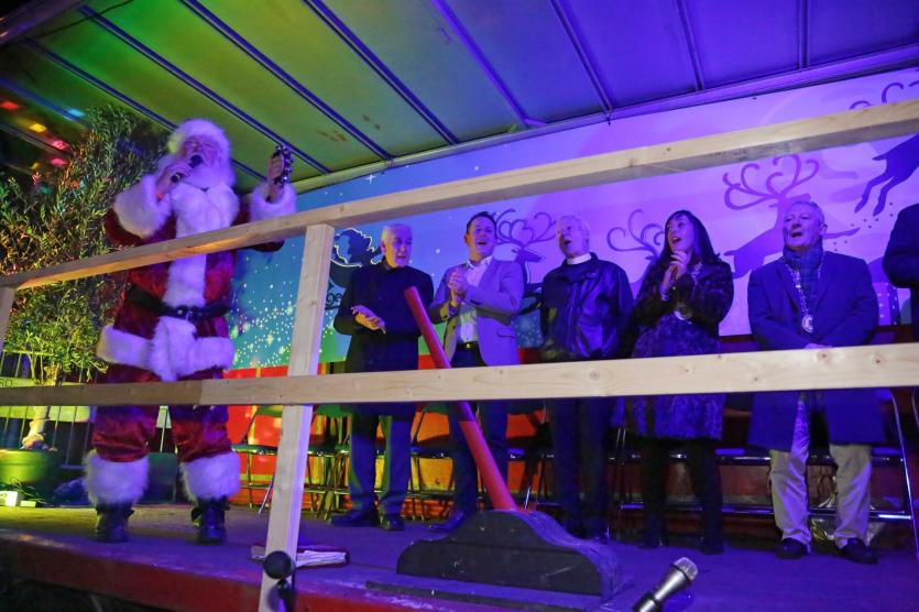 Santa, John Browne, Gerry Hagan, Canon David Catterall, Niamh Donlon, and Seamus Butler singing Jingle Bells Picture: Shelley Corcoran