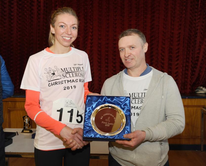 Matthew Thompson Presenrs 1st Lady Home to martina Gibbons at the Christmas Day Run  PICTURE DECLAN GILMORE