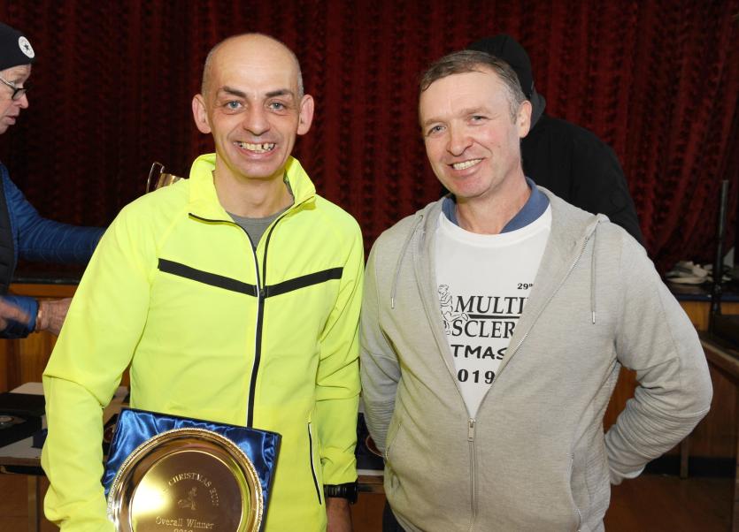 Matthew Thomptson Presents First Place Donal Mulligan at the Christmas Day Run  PICTURE DECLAN GILMORE