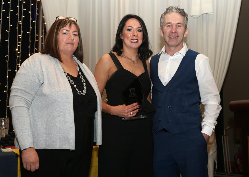 Fr Manning Gaels dinner dance 19.      St. Helens Ladies Chairperson Dawn Gorman & team manager Micheal Kane present Player of the year award to Louis