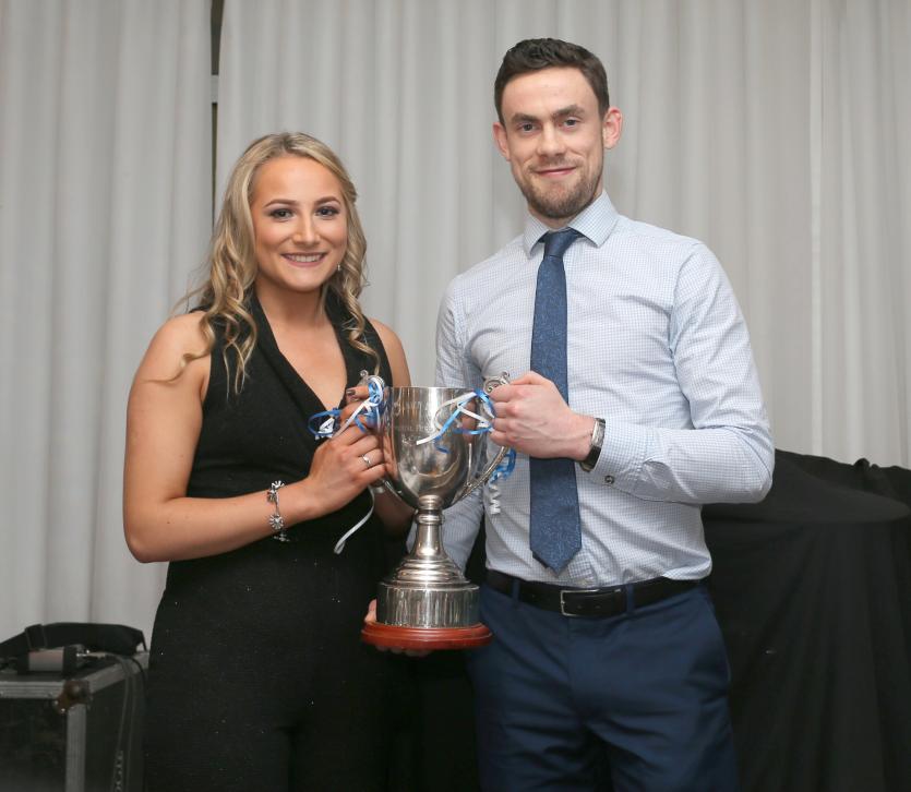 ILOL-31-01-20 Granard GAA 18.    Player of the year Paul Smyth receives the Damien Dawson memorial cup from Aoife Dawson.            Picture: Syl Heal