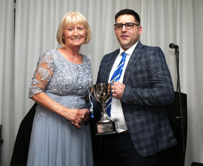  Kathleen Sheridan presents the Peter Sheridan memorial cup to Clubperson of the year Chairman Ciaran Walsh.            Picture: Syl Heal