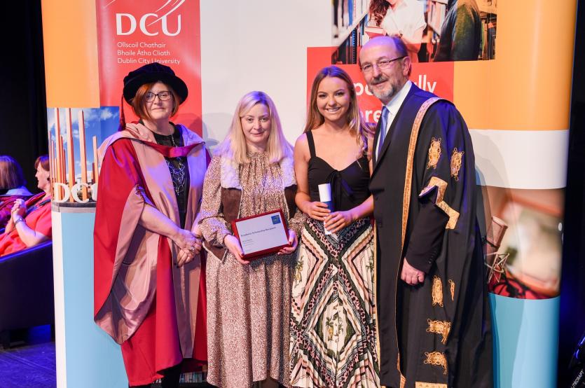 Orla Nevin being presented with a €500 Academic Scholarship to study at DCU, with Professor Brian MacCraith, President of DCU, guidance counsellor Mar
