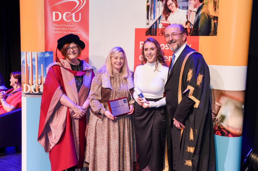 Leah Devlin receiving her award with Professor Brian MacCraith, Margarita Fallon and Professor Anne Looney