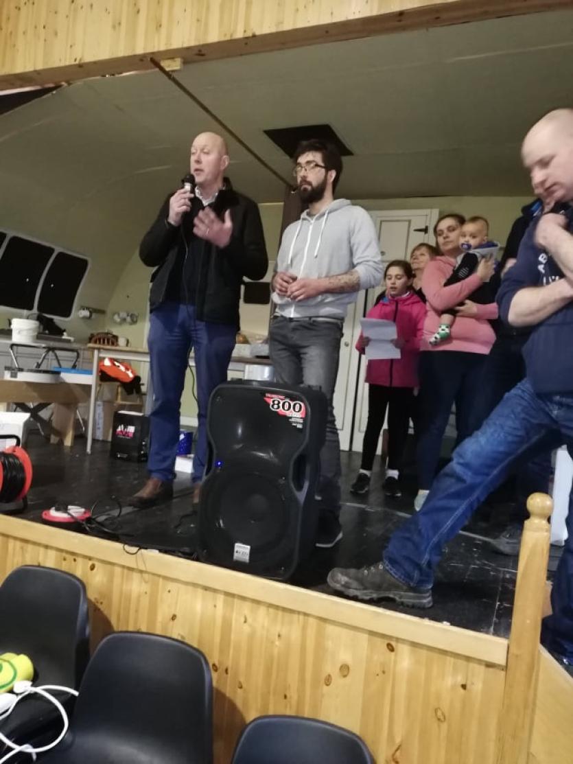 Cllr Paul Ross addresses crowds at the fundraiser, with the Mazurek family also present