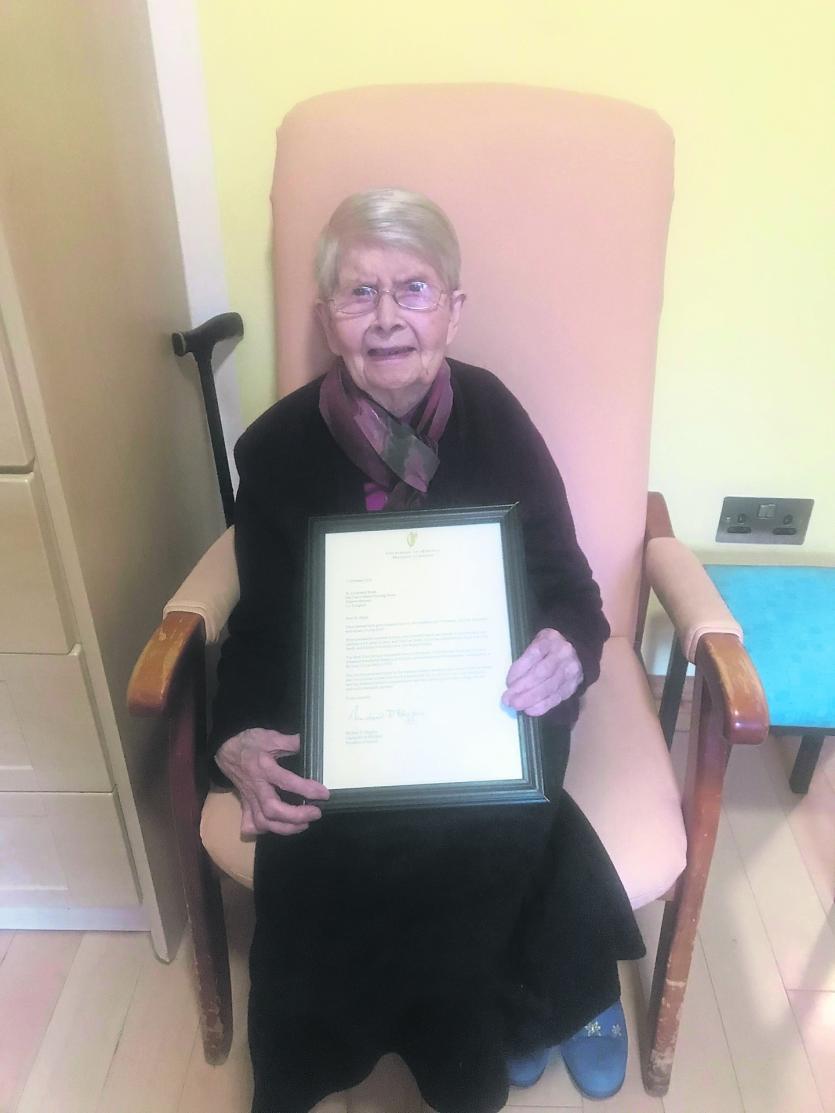Sr Elizabeth Brady with her letter from President Michael D Higgins congratulating her on 100 years. Sr Elizabeth was a Sister of Mercy in Ballymahon 