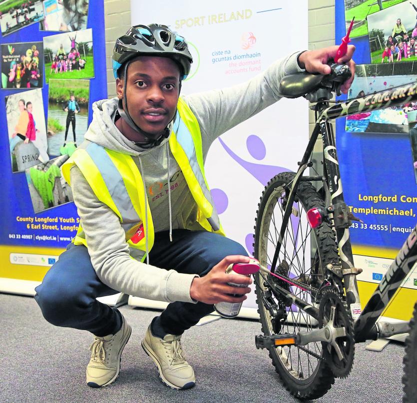 Thuba Mlobane pictured with his bike as the part of the 'On Your Bike' initiative Picture: Shelley Corcoran