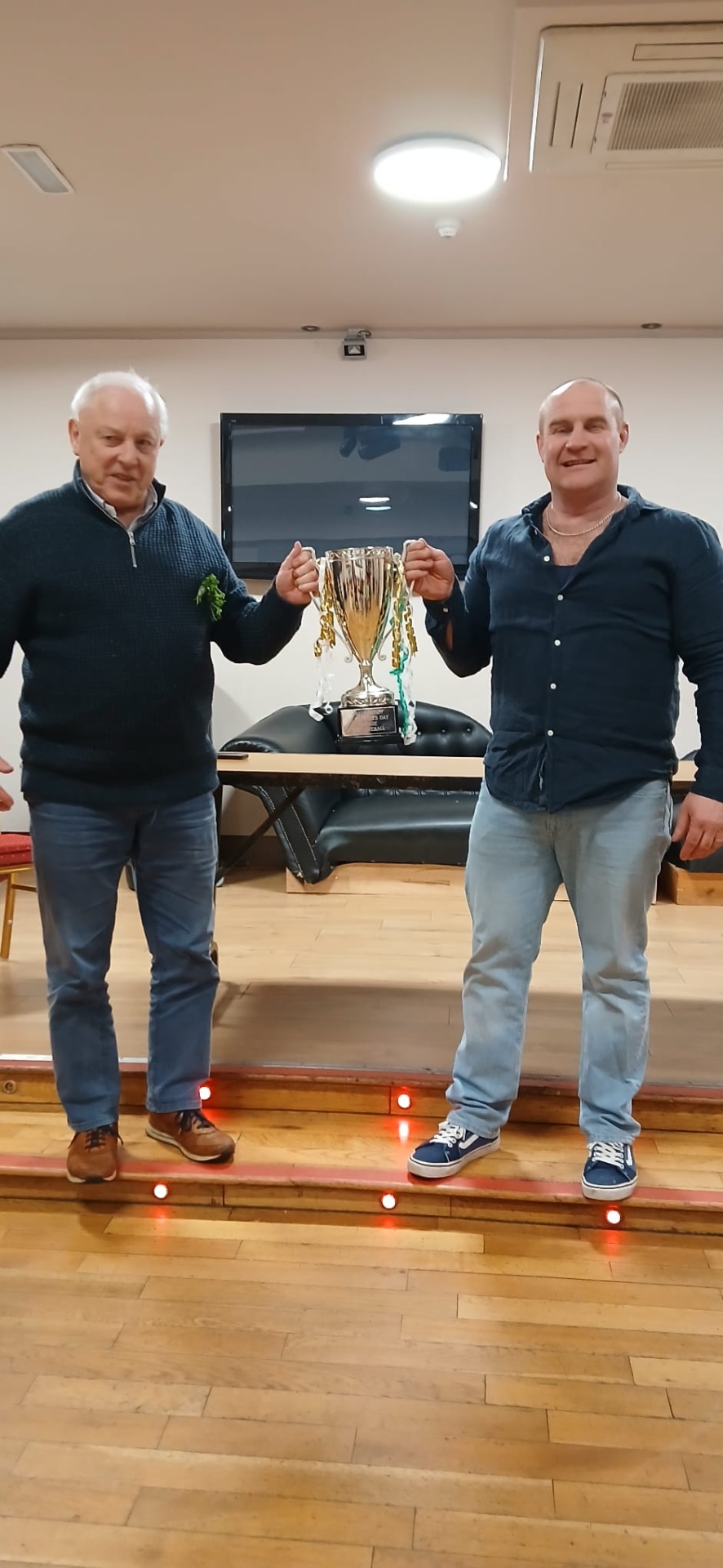 Pat O'Toole Chairman of Ballymahon St.Patrick's Day Committee presenting the cup for Overall Best Entry in this year's parade to Liam Kavanagh Chairman of the Forgney National School Parents Association.